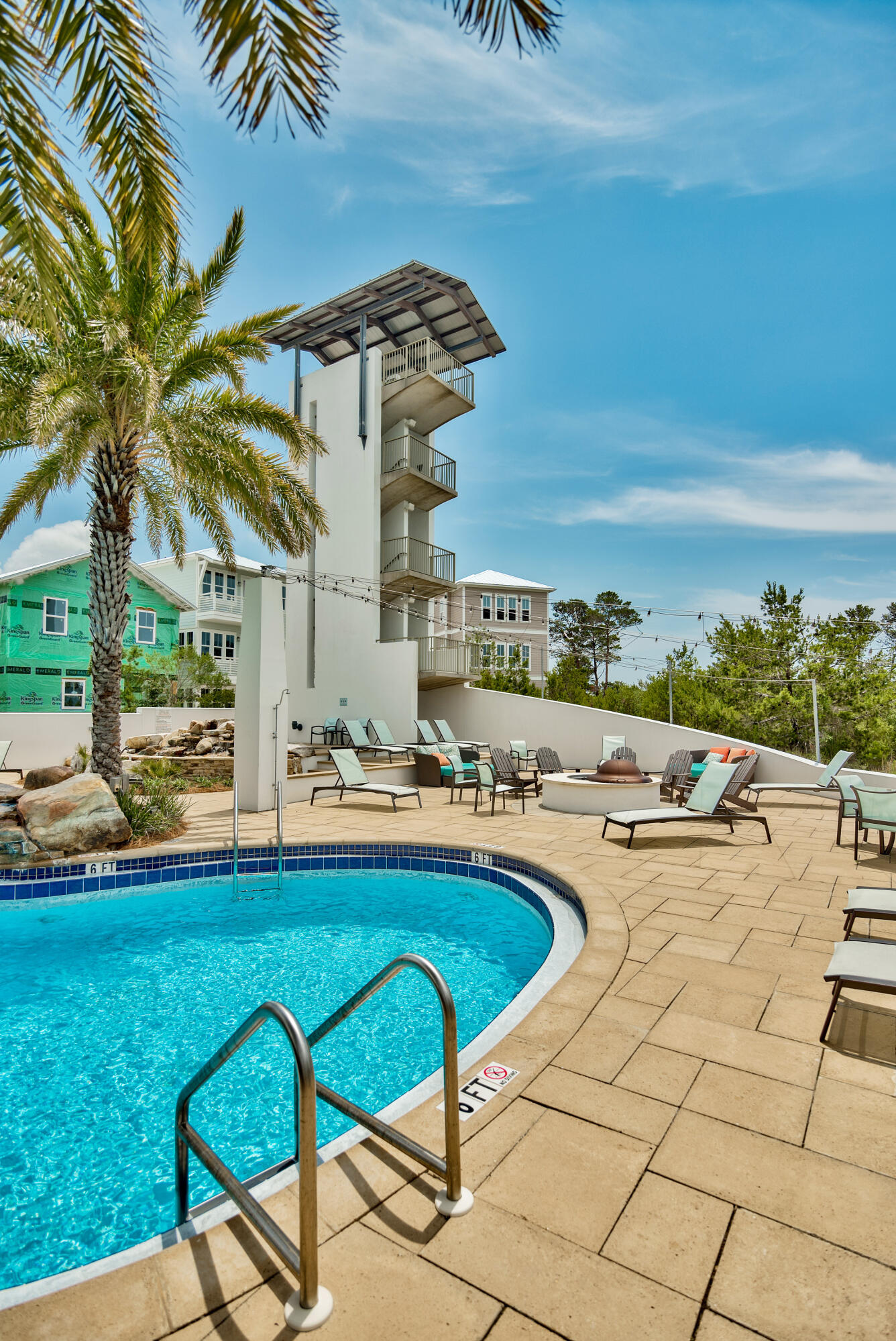 128 Emerald Beach Circle Santa Rosa Beach, FL 32459 - Photo 43 of 48 a view of a swimming pool and lounge chairs