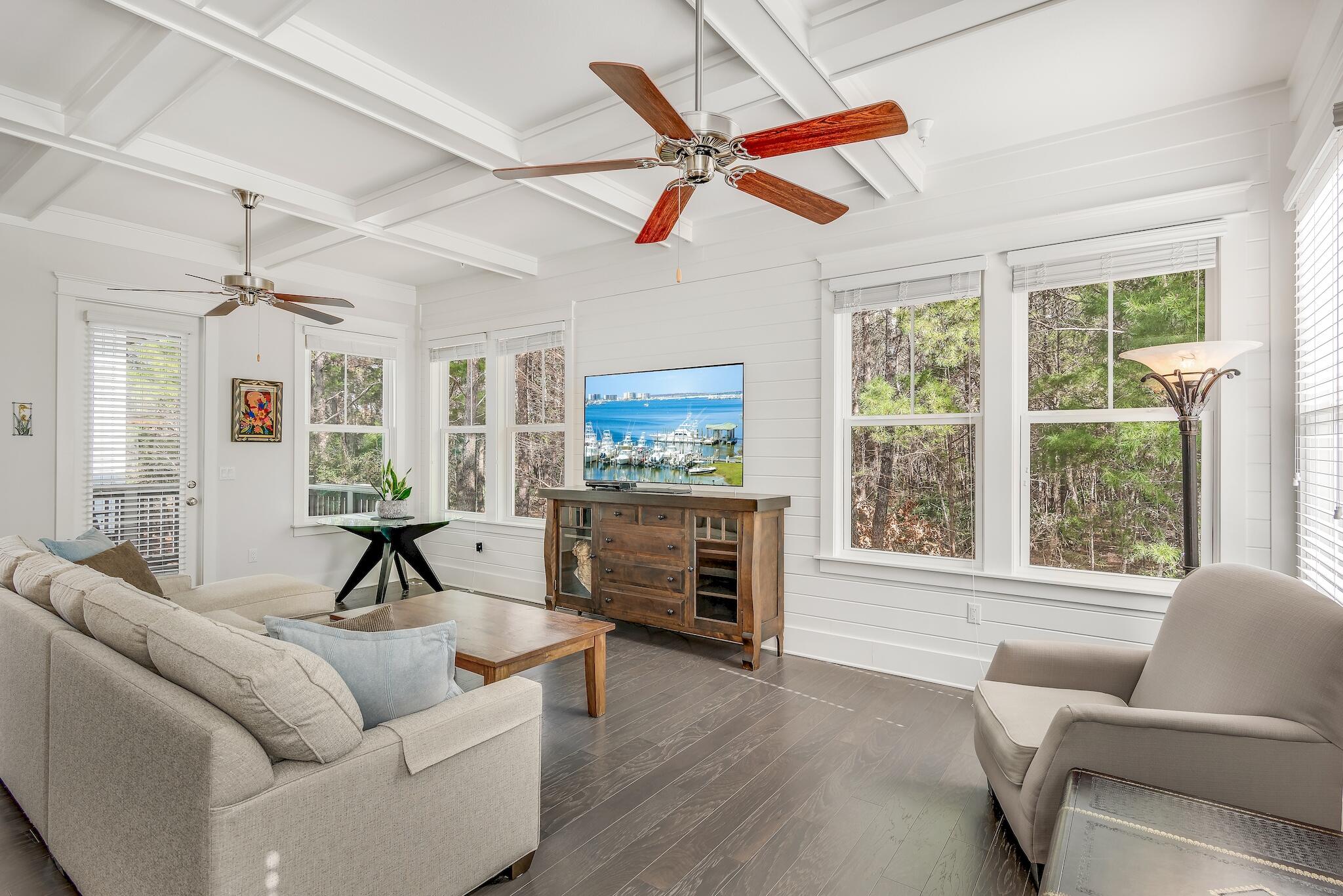 128 Emerald Beach Circle Santa Rosa Beach, FL 32459 - Photo 7 of 48 a living room with furniture and a fireplace