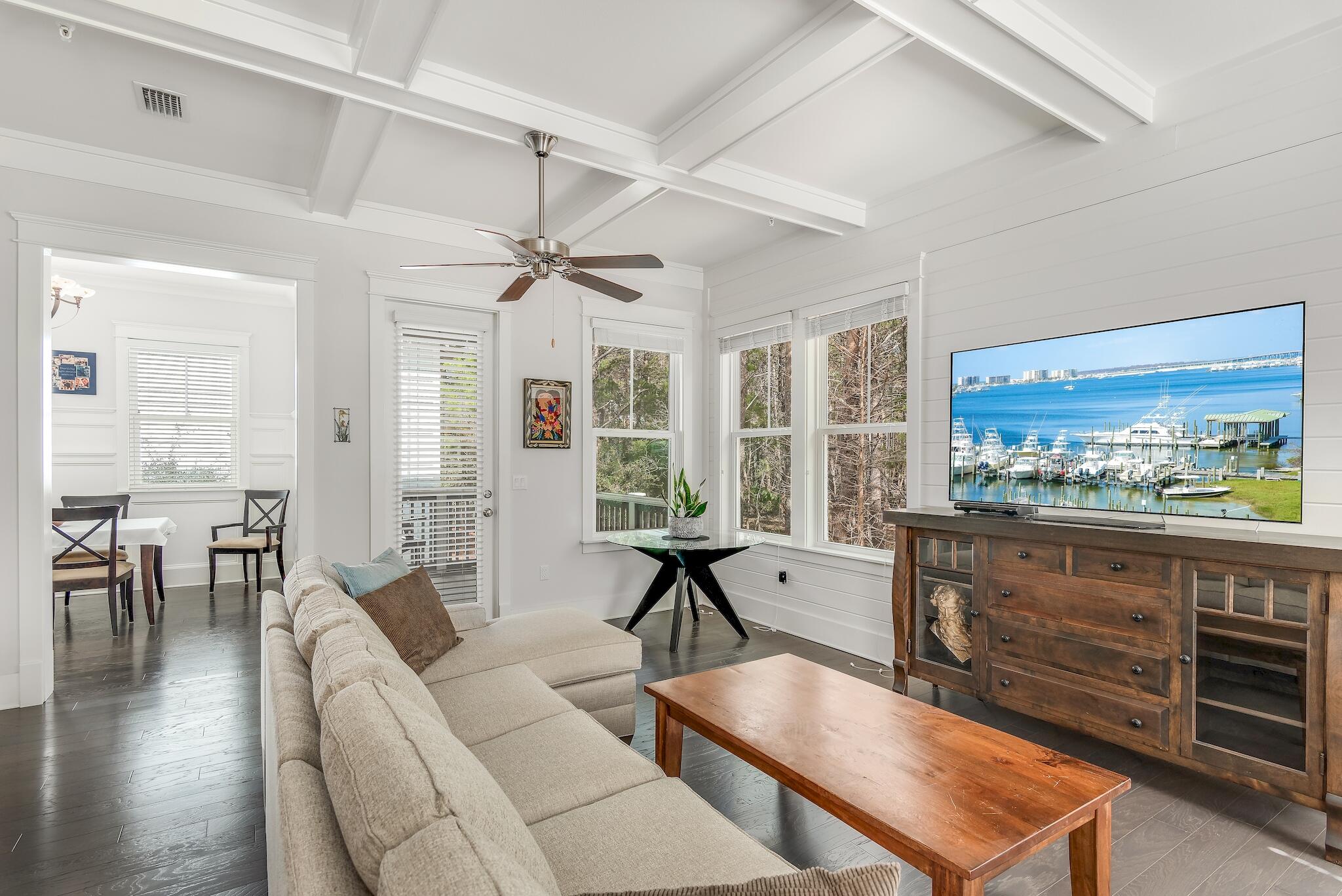 128 Emerald Beach Circle Santa Rosa Beach, FL 32459 - Photo 8 of 48 a living room with furniture a window and wooden floor