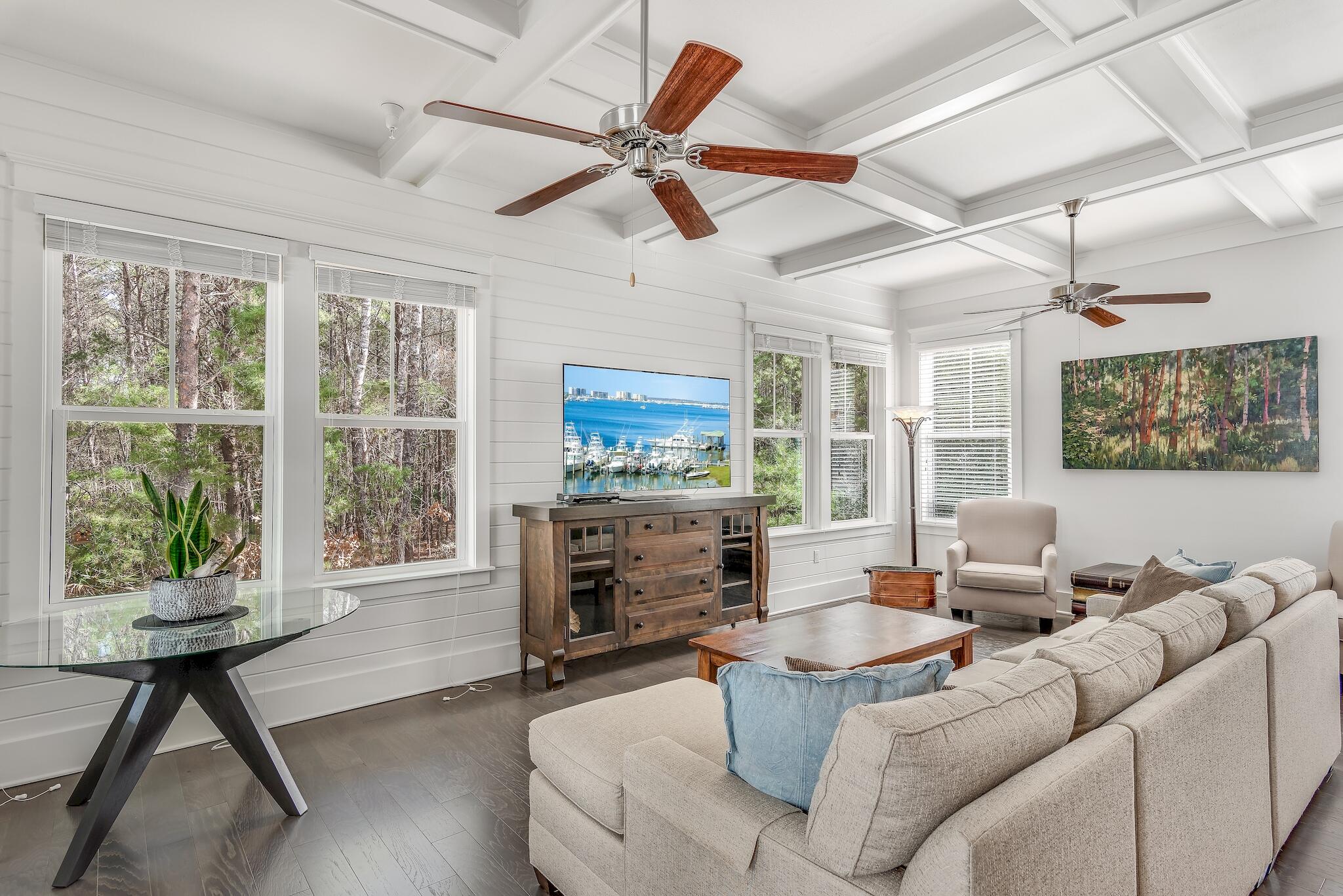 128 Emerald Beach Circle Santa Rosa Beach, FL 32459 - Photo 9 of 48 a living room with furniture a fireplace and a flat screen tv