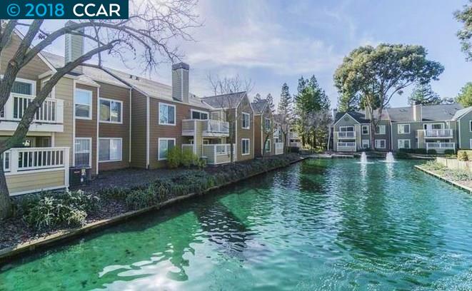 100 Reflections Drive, Unit 13 San Ramon, CA 94583 - Photo 1 of 1 a view of a lake with a building in the background