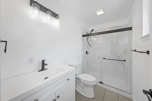 a bathroom with a sink a mirror and a shower