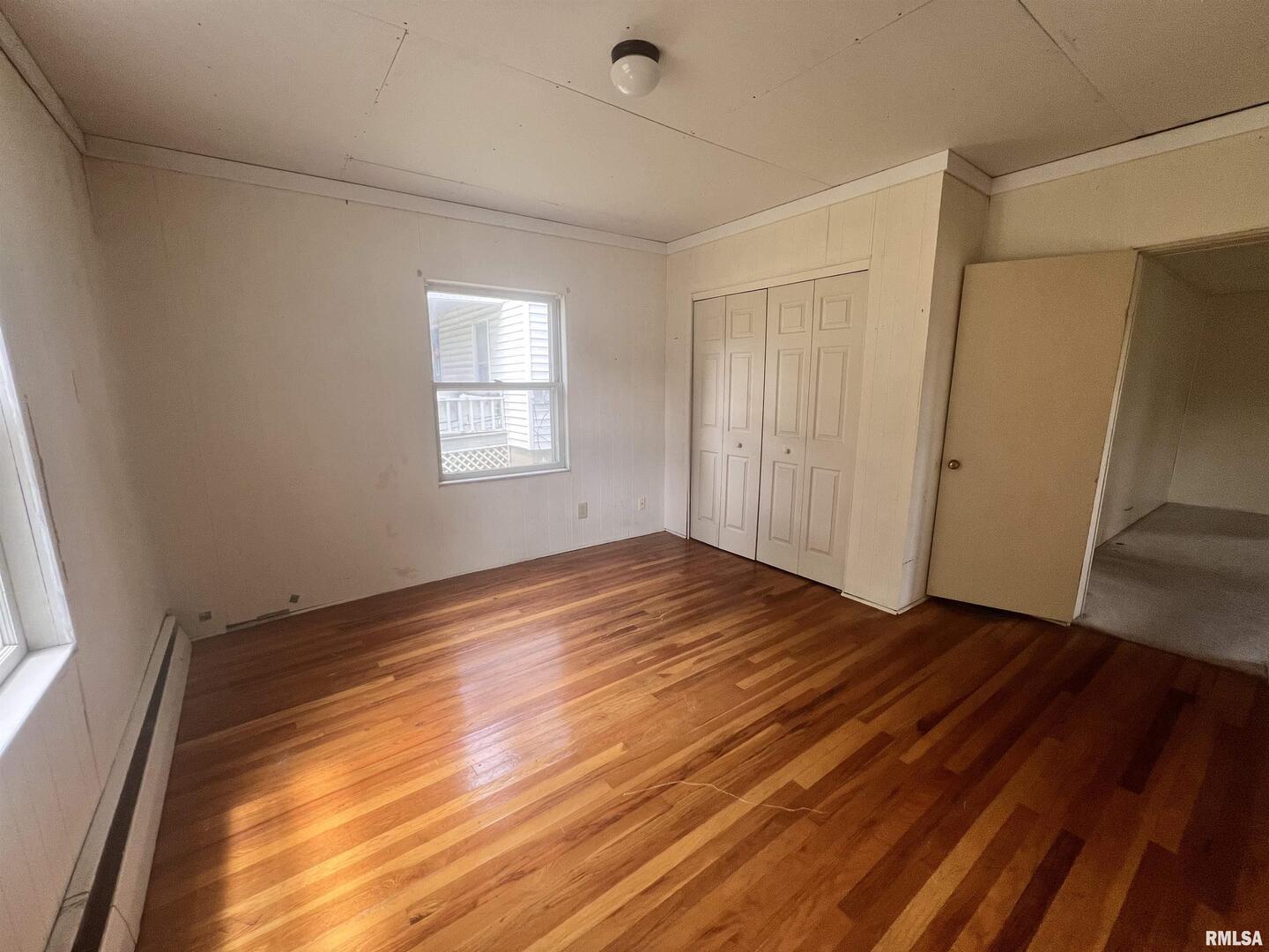 307 Morgan Street Anna, IL 62906 - Photo 15 of 15 a view of an empty room with wooden floor and a window