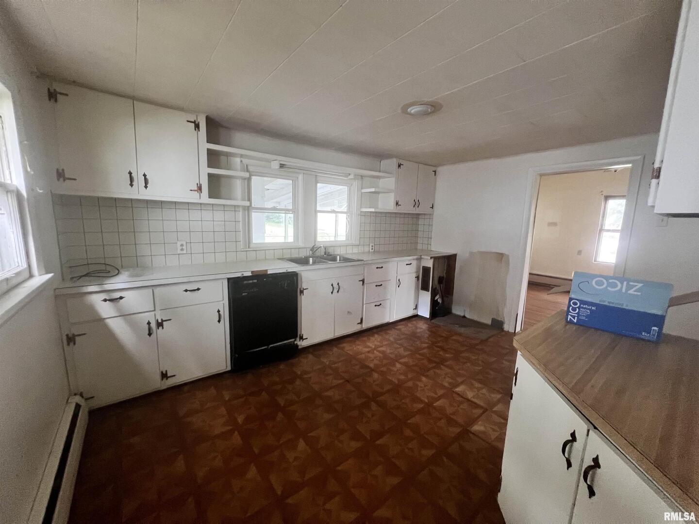 307 Morgan Street Anna, IL 62906 - Photo 4 of 15 a kitchen with a stove a refrigerator sink and cabinets