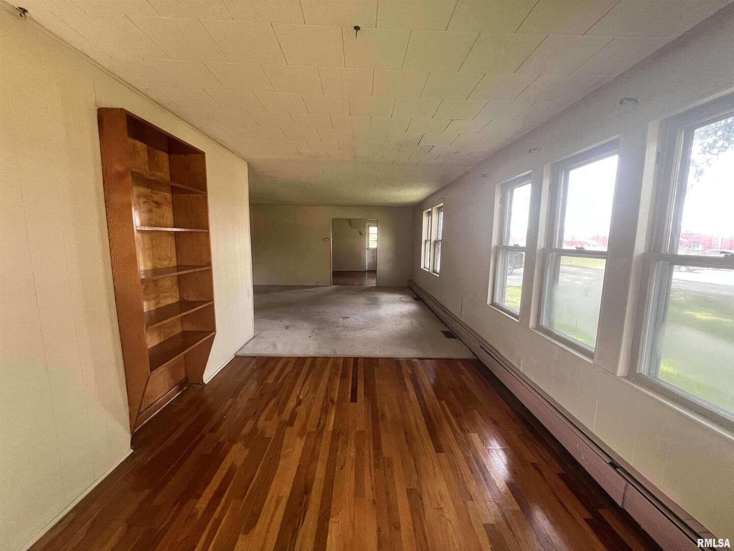 307 Morgan Street Anna, IL 62906 - Photo 7 of 15 a view of wooden floor in an empty room