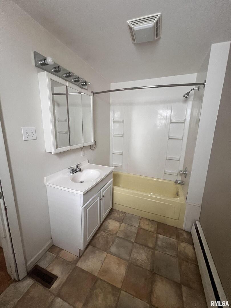 307 Morgan Street Anna, IL 62906 - Photo 10 of 15 a bathroom with a sink a bathtub and a shower