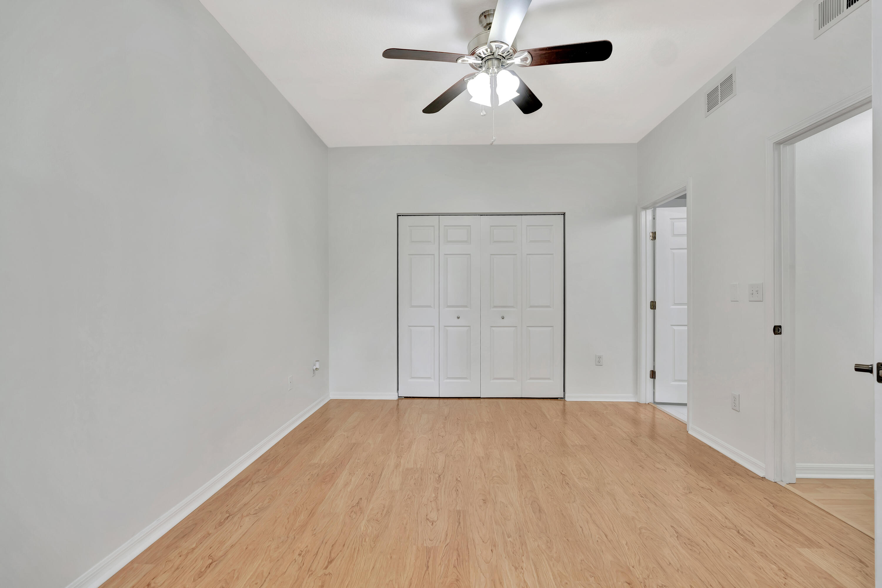 1561 Southeast Pomeroy Street Stuart, FL 34997 - Photo 22 of 25 wooden floor in an empty room