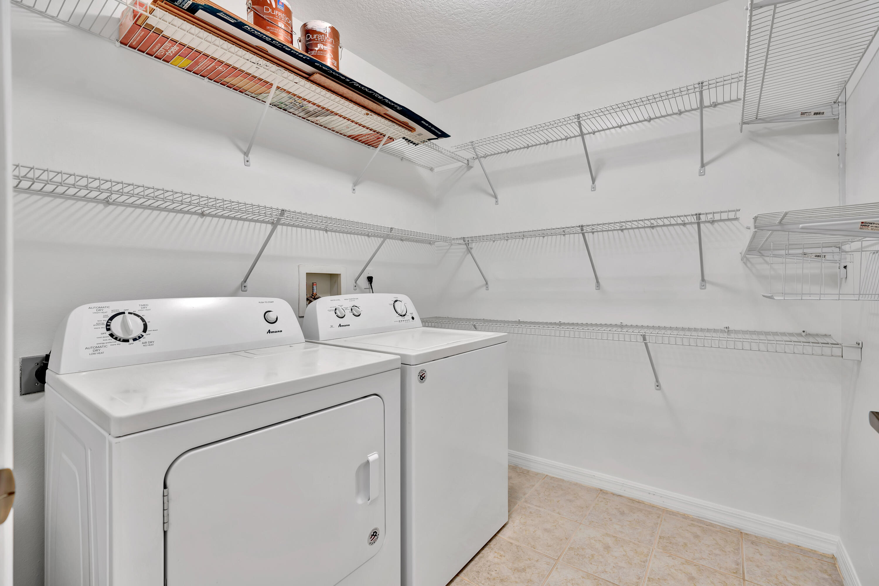 1561 Southeast Pomeroy Street Stuart, FL 34997 - Photo 24 of 25 a utility room with dryer and washer