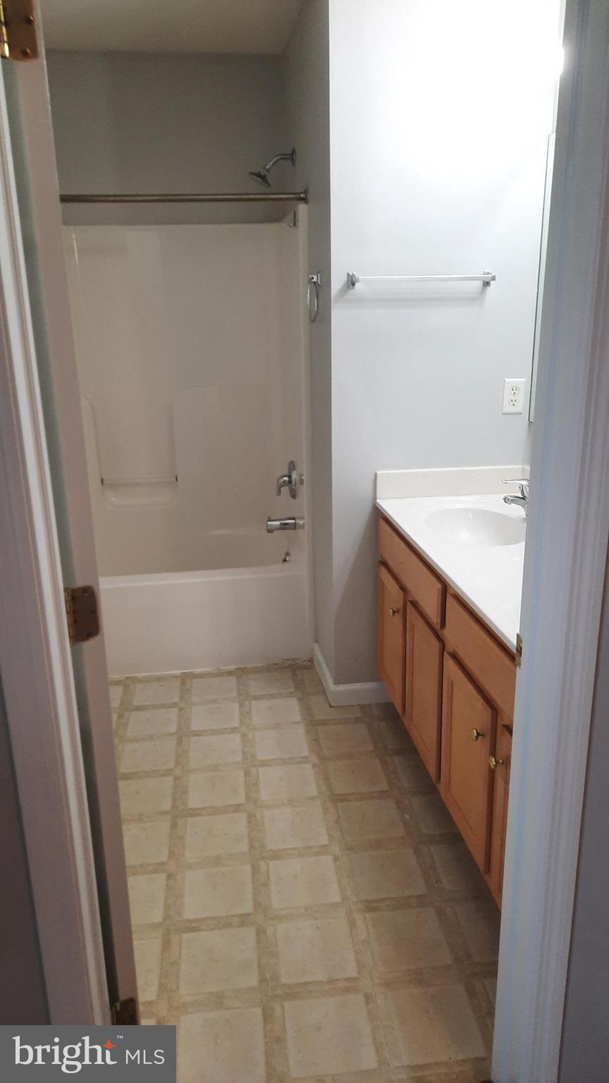 306 Sherman Avenue Carlisle, PA 17013 - Photo 8 of 11 a bathroom with a sink a toilet and shower