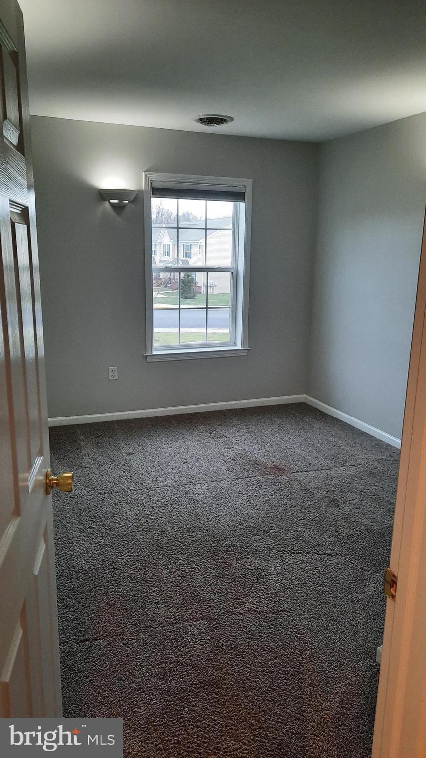 306 Sherman Avenue Carlisle, PA 17013 - Photo 9 of 11 an empty room with windows