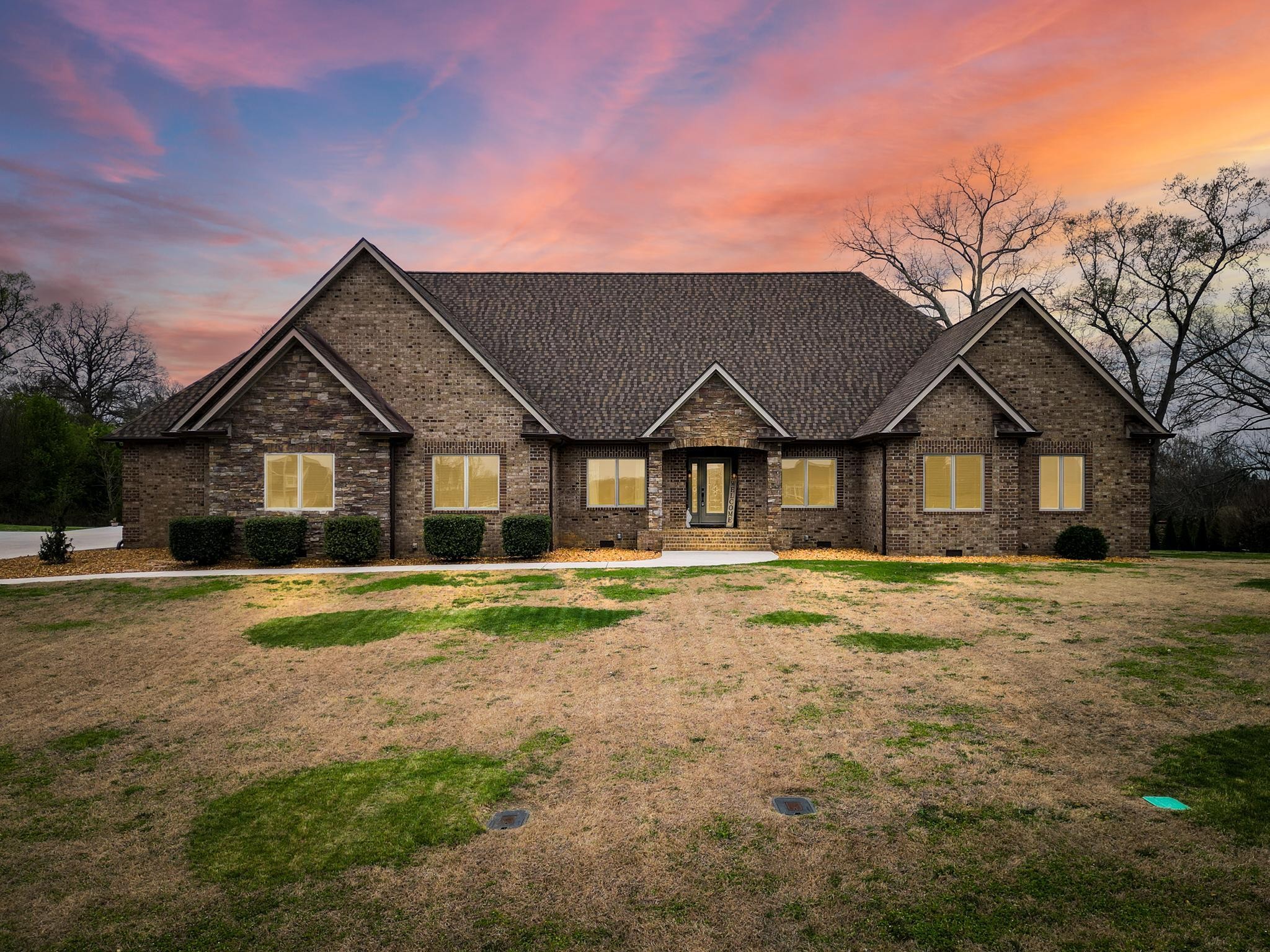 a front view of a house with a yard