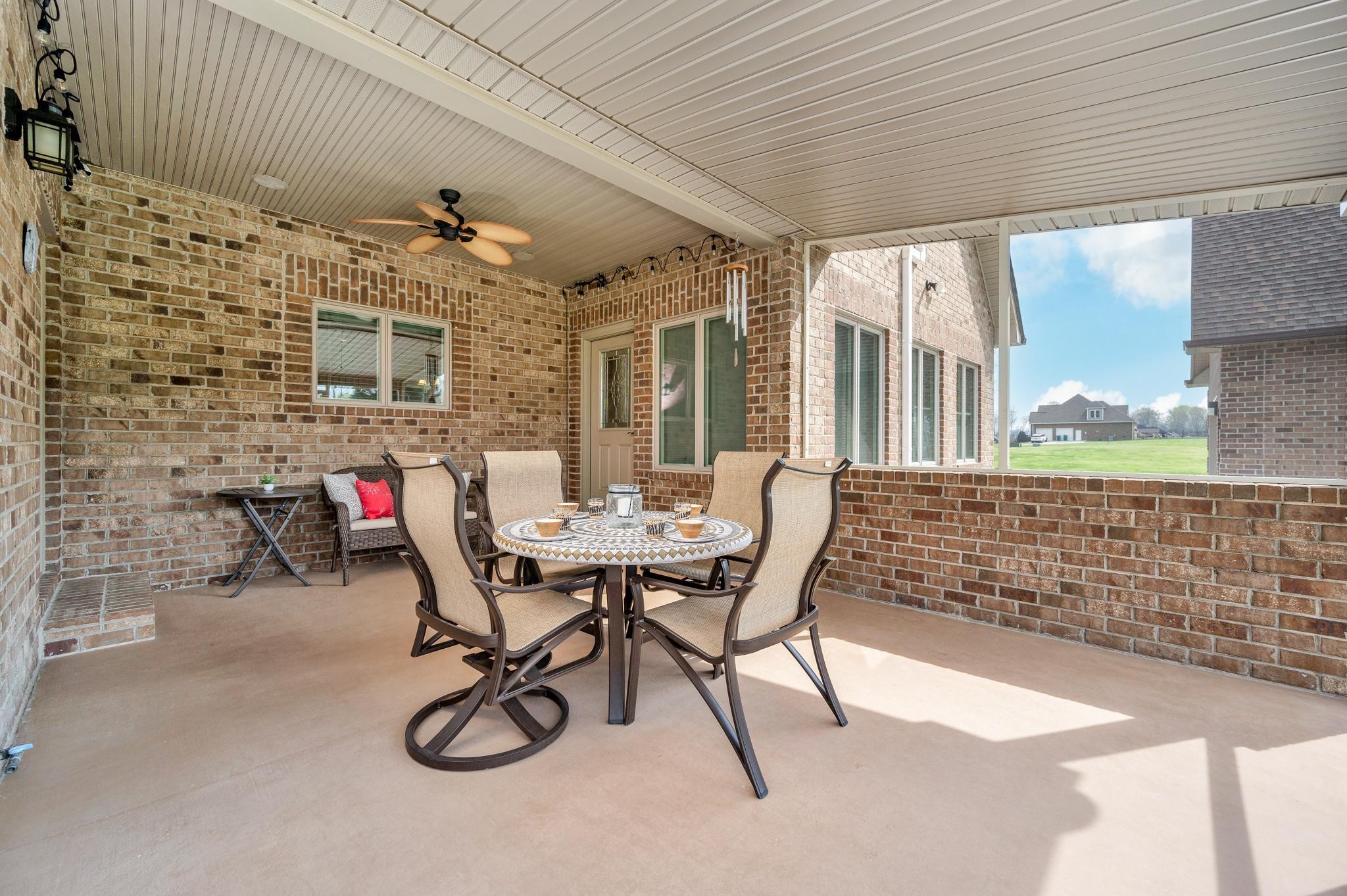 290 Cascade Drive Winchester, TN 37398 - Photo 14 of 68 a view of a patio with table and chairs and potted plants