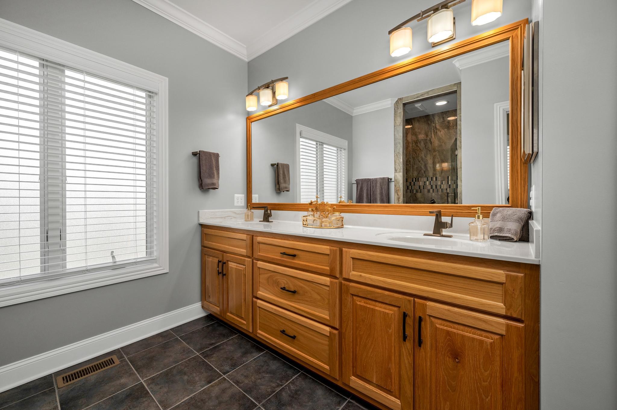 290 Cascade Drive Winchester, TN 37398 - Photo 36 of 68 a spacious bathroom with a granite countertop sink a mirror and a window