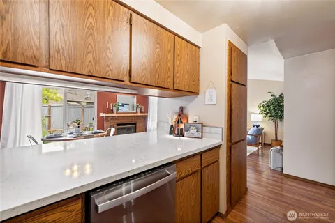 a kitchen with stainless steel appliances a sink and cabinets