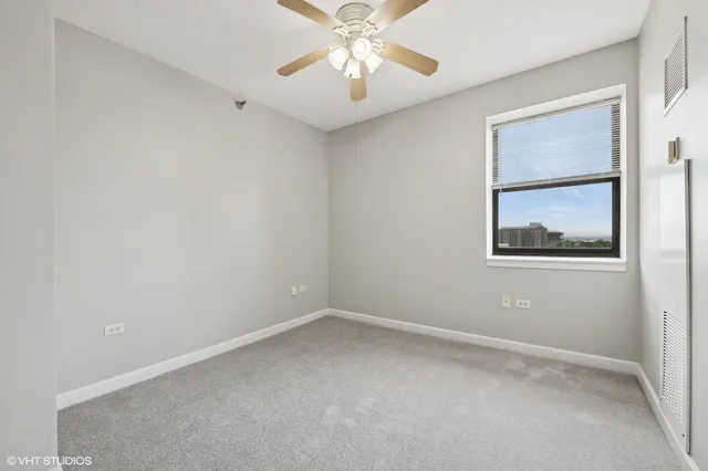 a bathroom with a double vanity sink toilet and a mirror