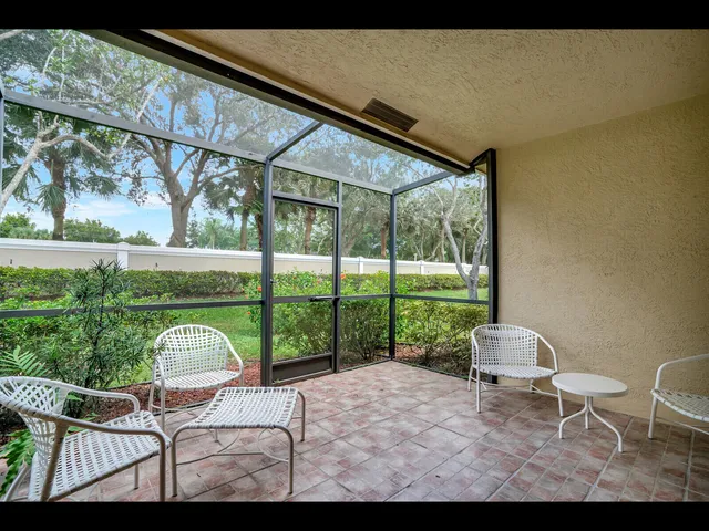 a view of sitting area and porch in front of yard