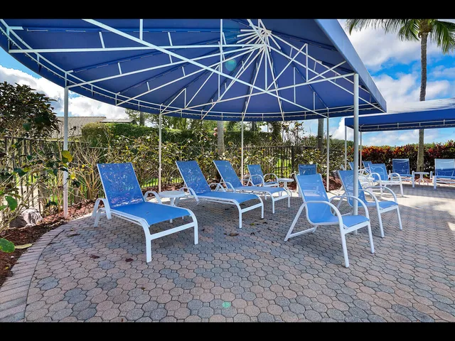a dining room with furniture window and wooden floor