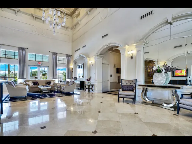 a room with pool tables and windows