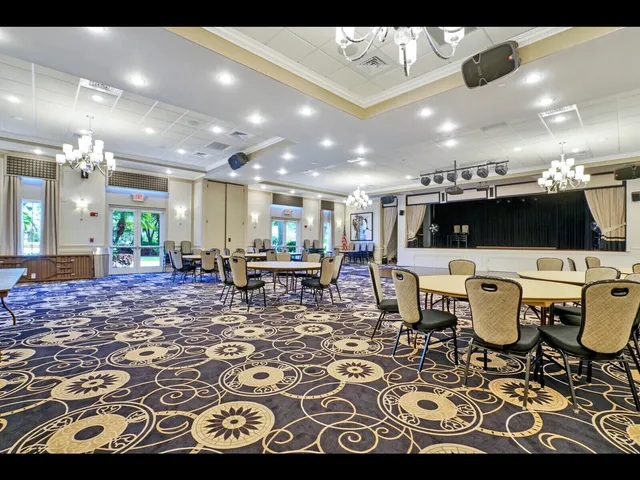 a front view of a house with yard patio and green space