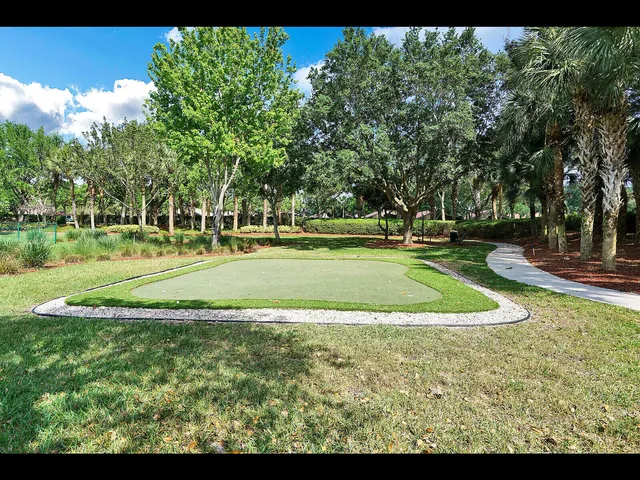an aerial view of a house with a lake view