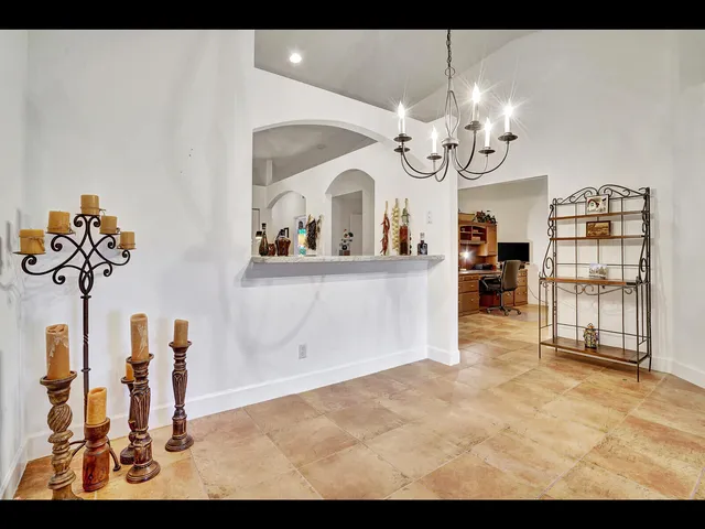 a view of a living room and chandelier