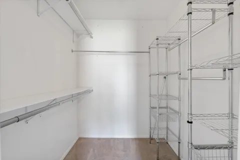 a bathroom with a toilet a sink a tub and mirror