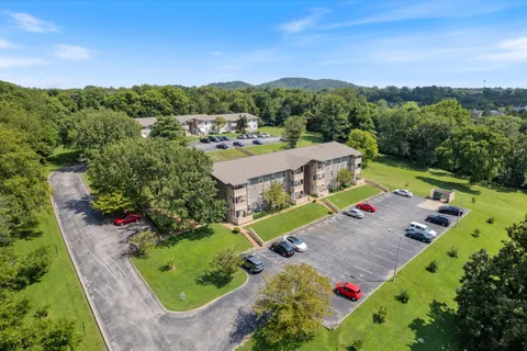 an aerial view of a house with a garden