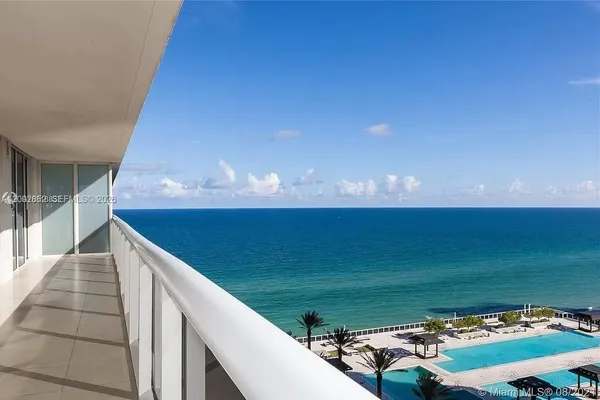 a view of a balcony with an ocean