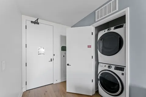 a view of a hallway with washer and dryer