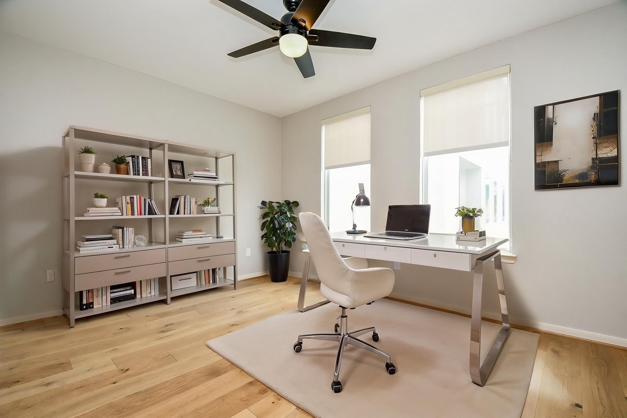 505 Jackson Hill Street, Unit 307 Houston, TX 77007 - Photo 13 of 30 a workspace with furniture window and wooden floor