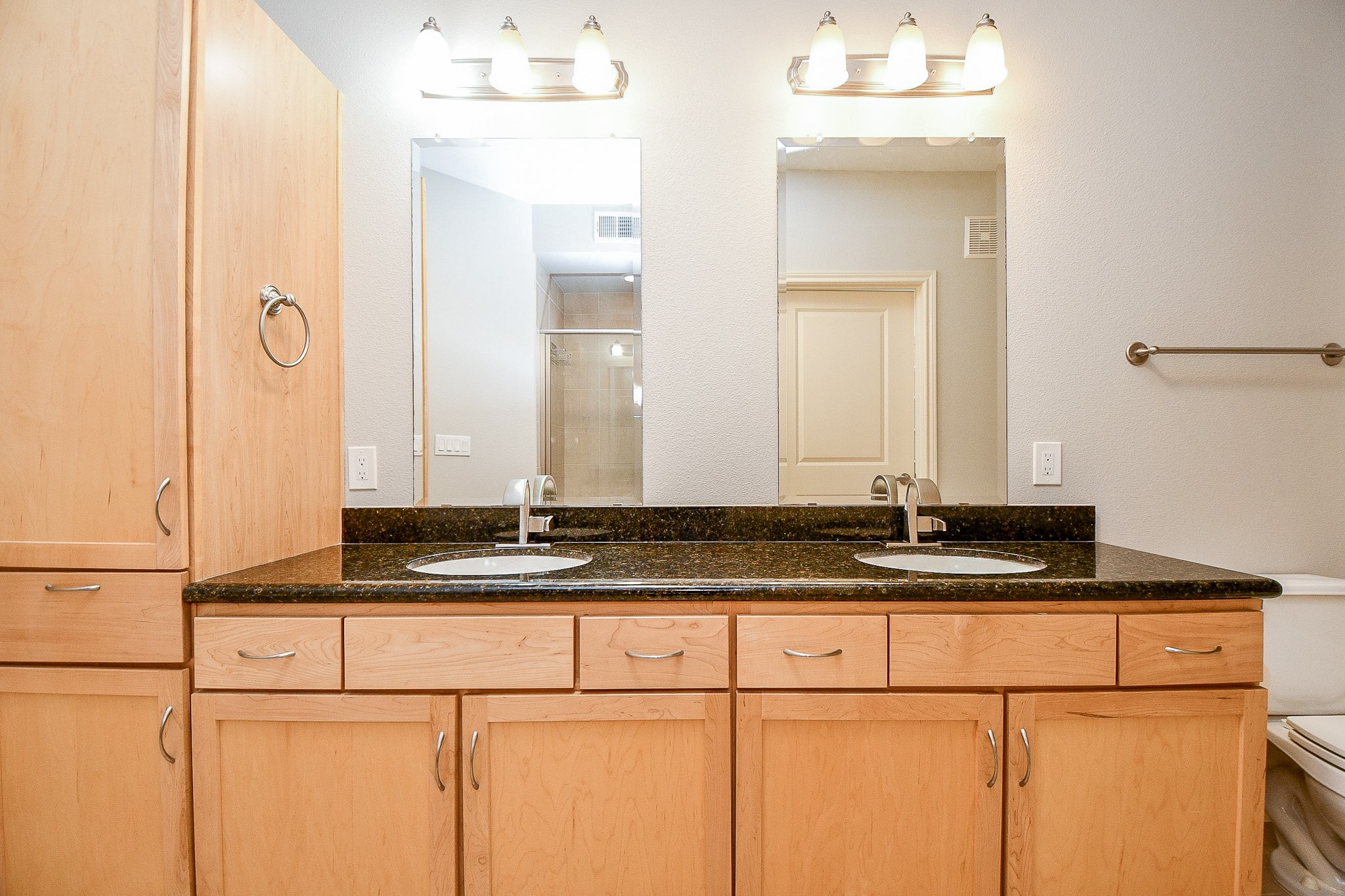 505 Jackson Hill Street, Unit 307 Houston, TX 77007 - Photo 25 of 30 a bathroom with a granite countertop sink and a mirror