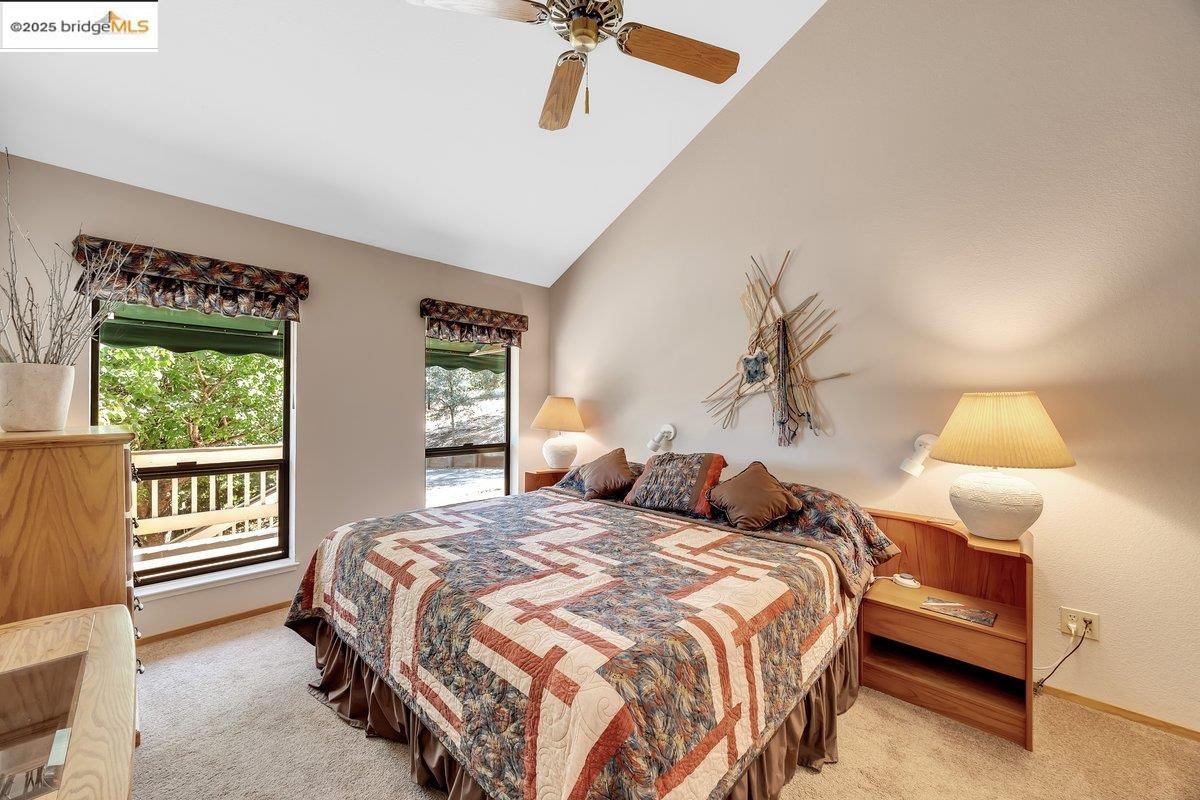 13700 Clements Road Groveland, CA 95321 - Photo 43 of 93 Bedroom featuring light colored carpet, ceiling fan, and high vaulted ceiling