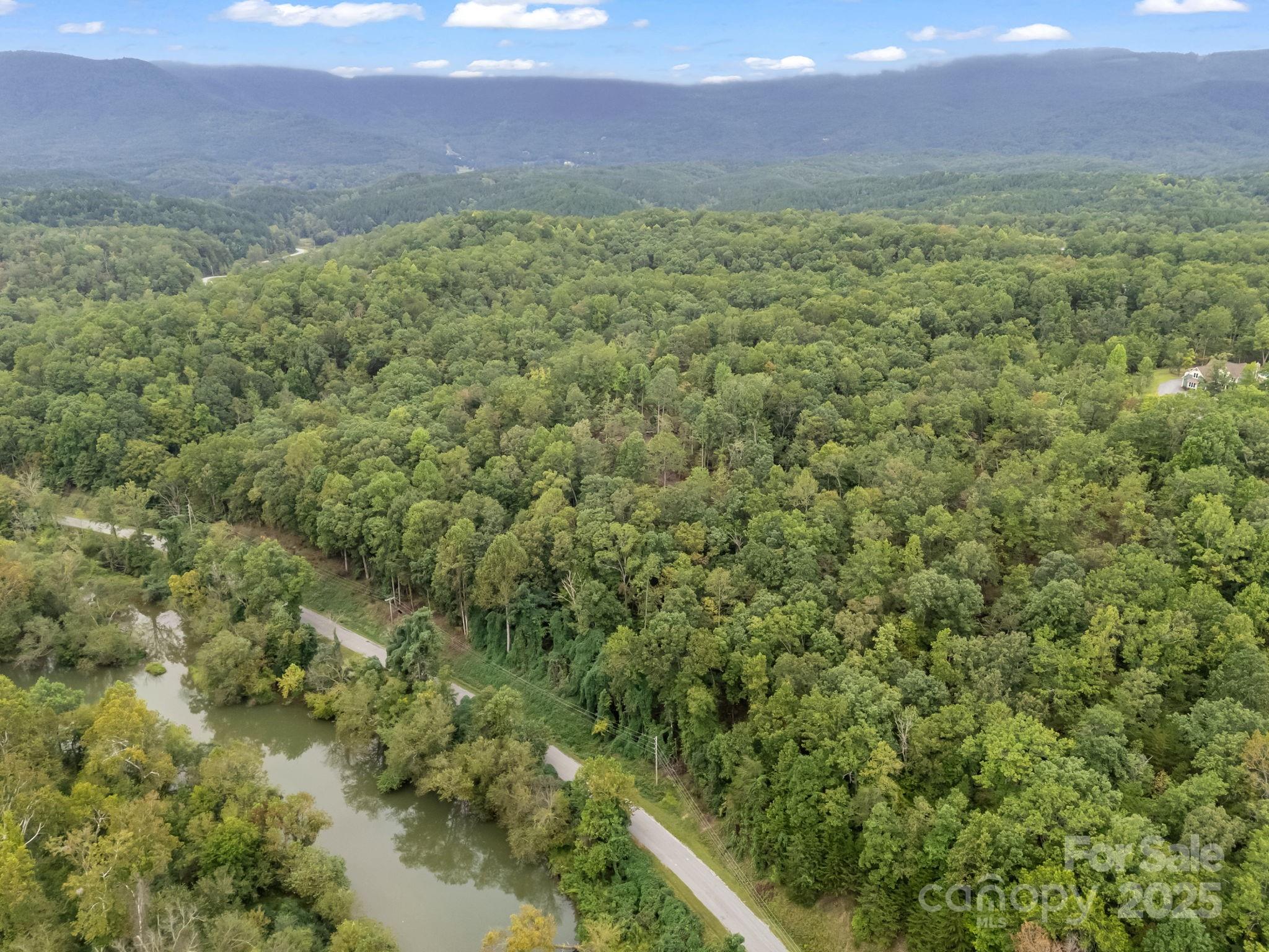 Tbd North Highland Road, Unit 6 Mill Spring, NC 28756 - Photo 4 of 37 a view of an outdoor space with a lake view and mountain view