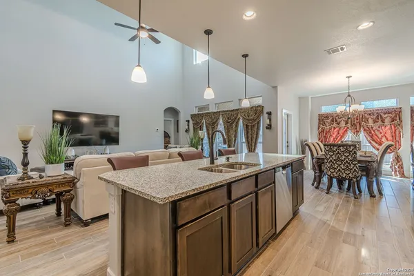 a kitchen with a table and chairs in it