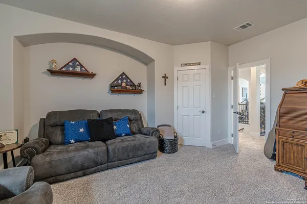 a living room with furniture and a rug
