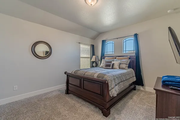 a bedroom with a bed and a closet