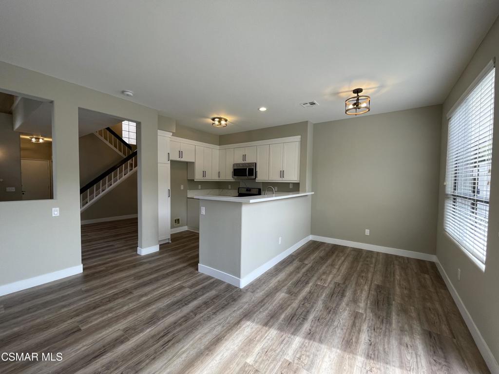 429 Dante Way Oak Park, CA 91377 - Photo 11 of 37 a view of kitchen with wooden floor and electronic appliances