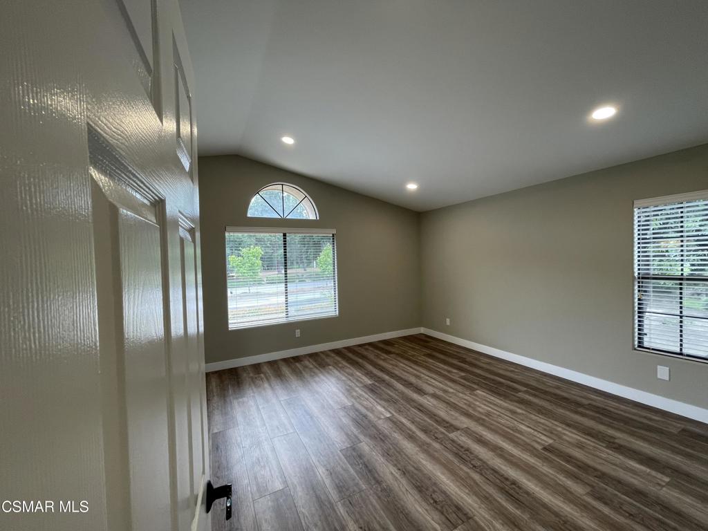 429 Dante Way Oak Park, CA 91377 - Photo 20 of 37 an empty room with wooden floor and windows