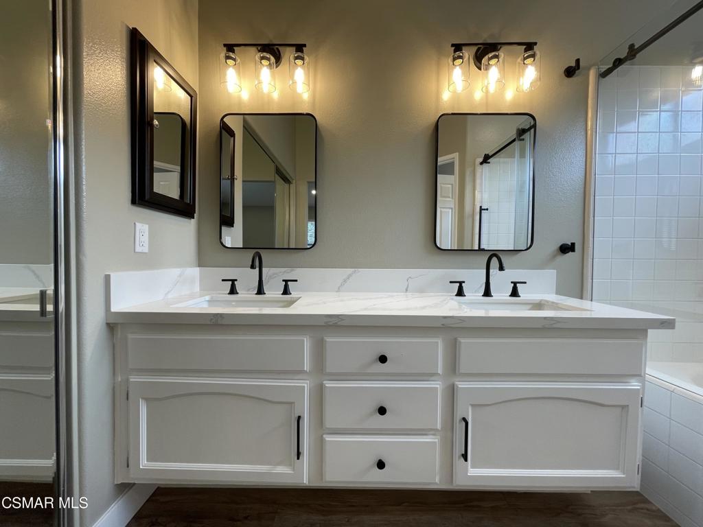429 Dante Way Oak Park, CA 91377 - Photo 23 of 37 a bathroom with double vanity sink and a mirror