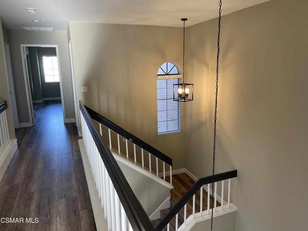 429 Dante Way Oak Park, CA 91377 - Photo 28 of 37 a view of a hallway with wooden floor and staircase