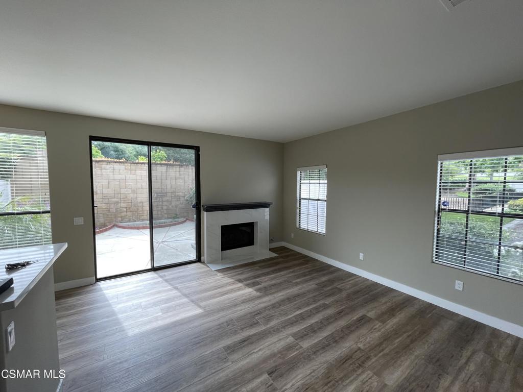 429 Dante Way Oak Park, CA 91377 - Photo 9 of 37 wooden floor in an empty room with a fireplace