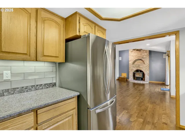 a kitchen with a refrigerator and a sink