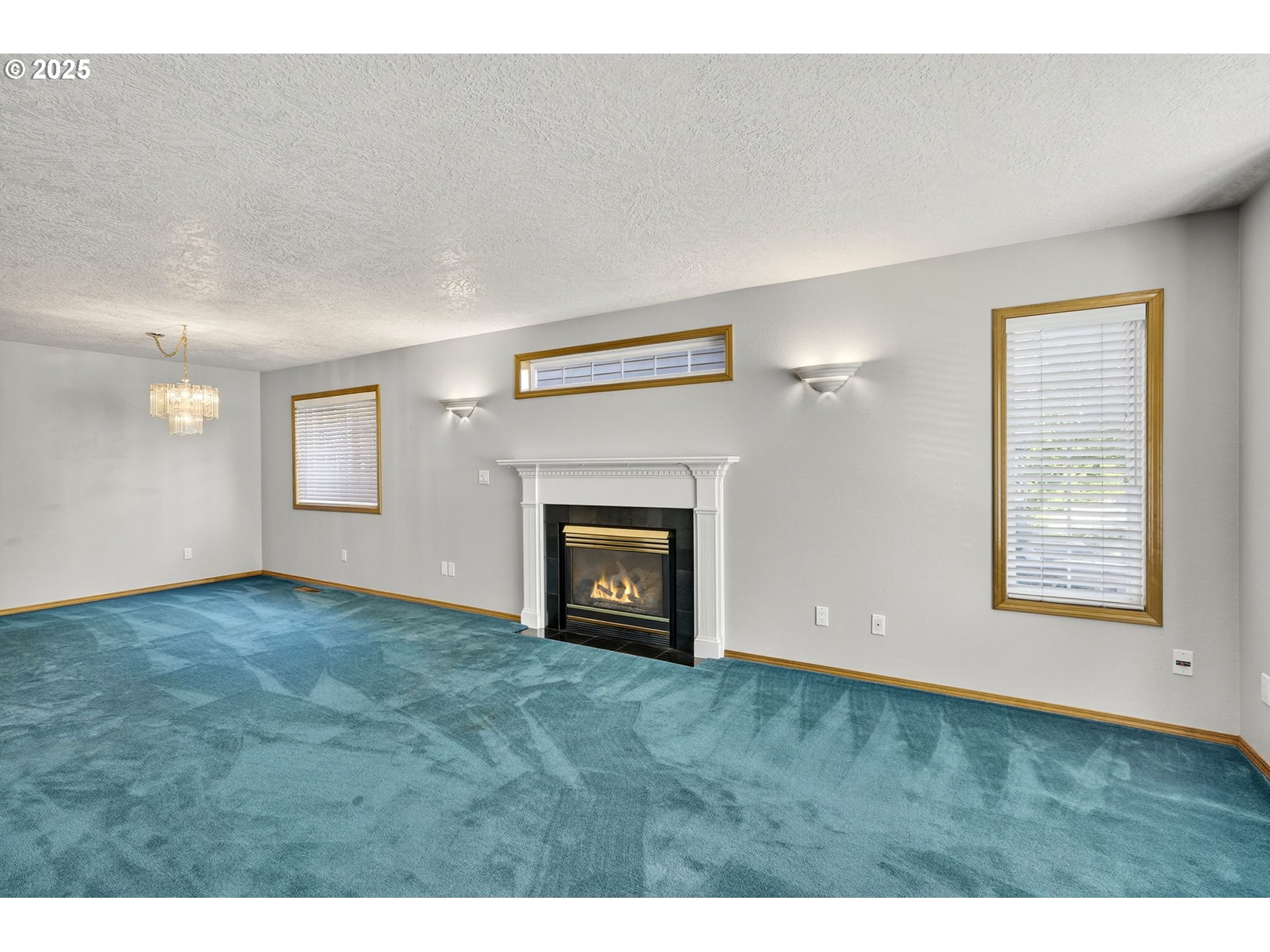 535 Northeast 24th Street Gresham, OR 97030 - Photo 3 of 41 a view of an empty room with a fireplace and a window