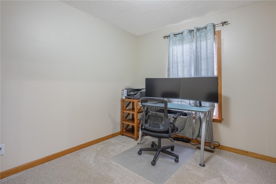 2645 Vance Road St. Paris, OH 43072 - Photo 15 of 35 This dedicated home office offers a comfortable and practical workspace with carpeting and a window.