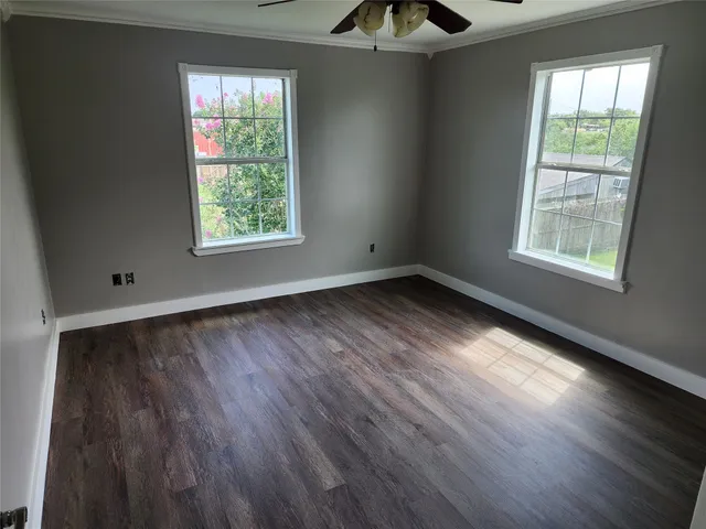 a kitchen with stainless steel appliances a refrigerator sink and wooden floor