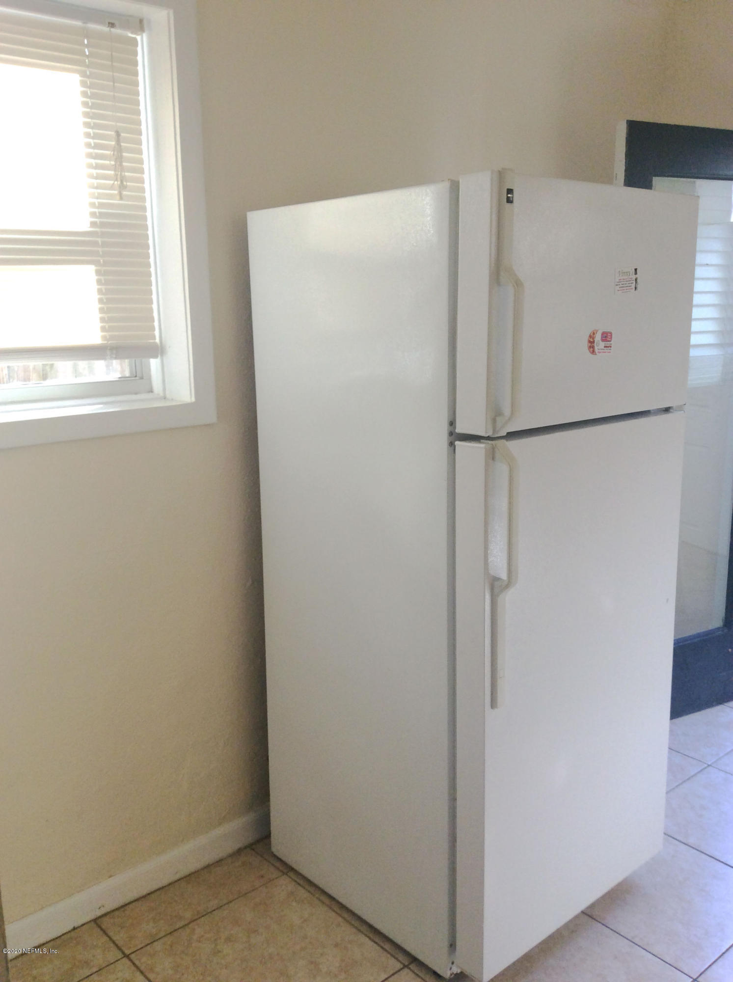 9 Sylvan Drive, Unit B St. Augustine, FL 32084 - Photo 4 of 10 a white refrigerator freezer sitting in a kitchen