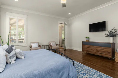 a bathroom with a granite countertop sink toilet and a mirror