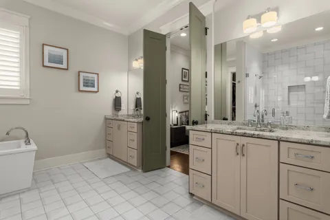 a bedroom with a bed a desk and chair