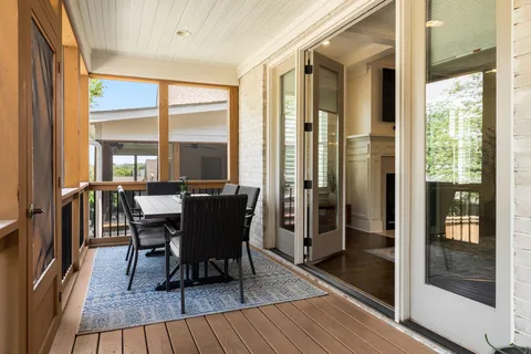 a front view of a house with a garden and sitting area