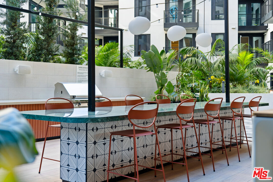 250 East Broadway, Unit 803 Long Beach, CA 90802 - Photo 17 of 44 a view of a chairs and table in patio